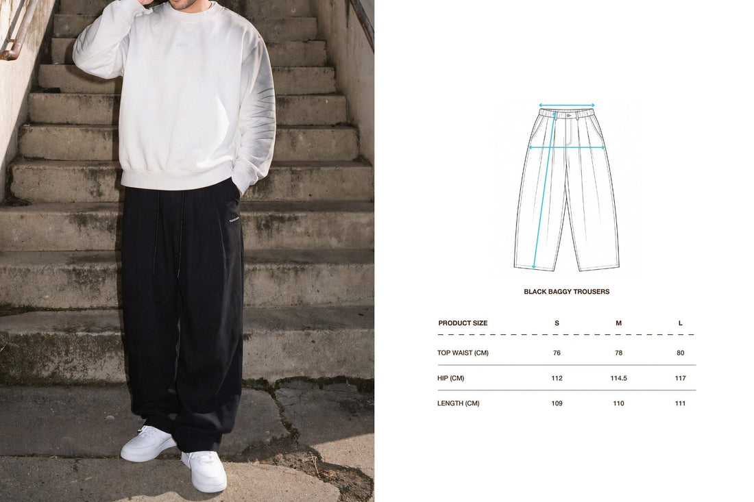 Man wearing SAMA Black Baggy Trousers with a white ribbed long sleeve, beside the trousers' size and measurement chart